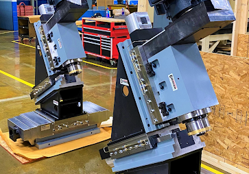 Two custom machines with main slide and spindle components built by Gilman Precision